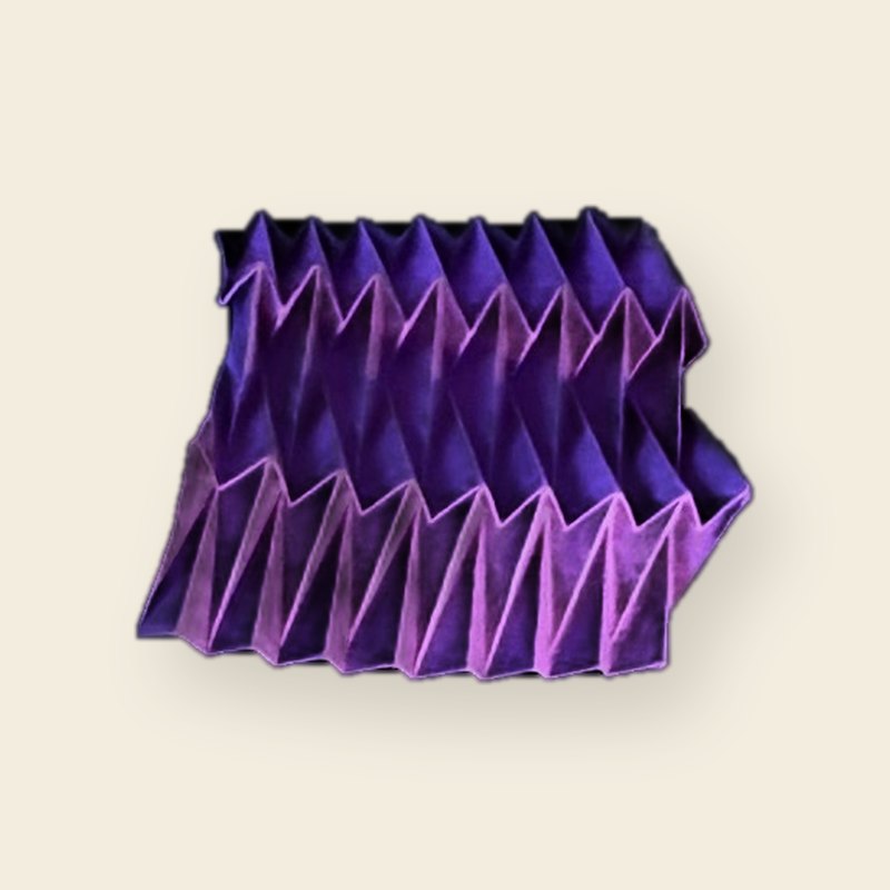 A violet pleated tessellation panel on unbleached paper